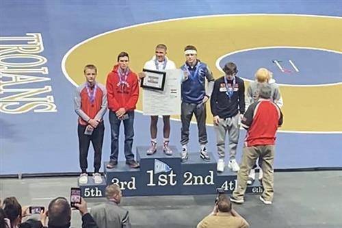 Kyle Owen on the podium after placing 3rd at state